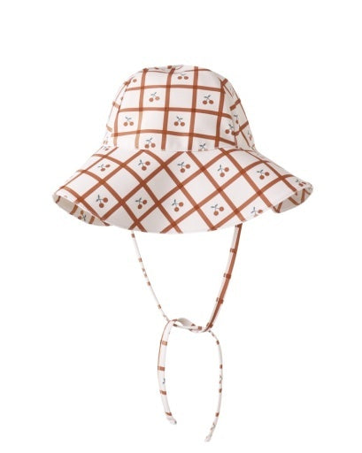 Plaid patterned sun hat with a tie on a white background, cherry plaid, cherries and cream, sun hat, sunny essential, tie on hat