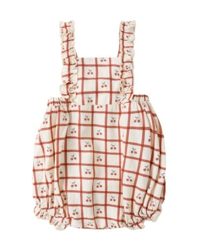 Baby romper with plaid and cherry pattern on a white background, red and cream, cherry pie cutie, ruffle straps, scrunch short, cherries