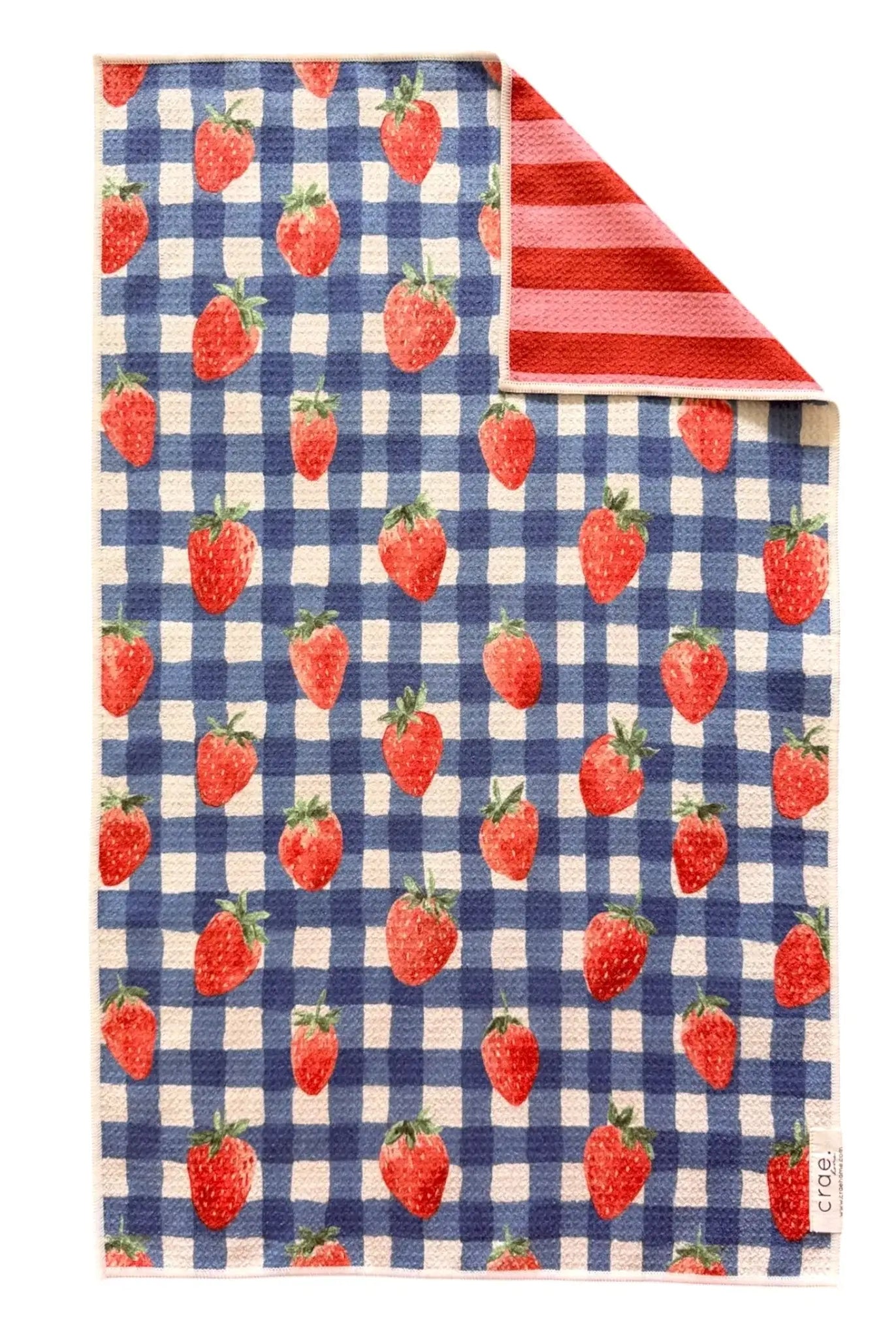 Towel with strawberry pattern on a blue and white checkered pattern, reversible side has red and pink stripe pattern, hand towel, kitchen towel, gift