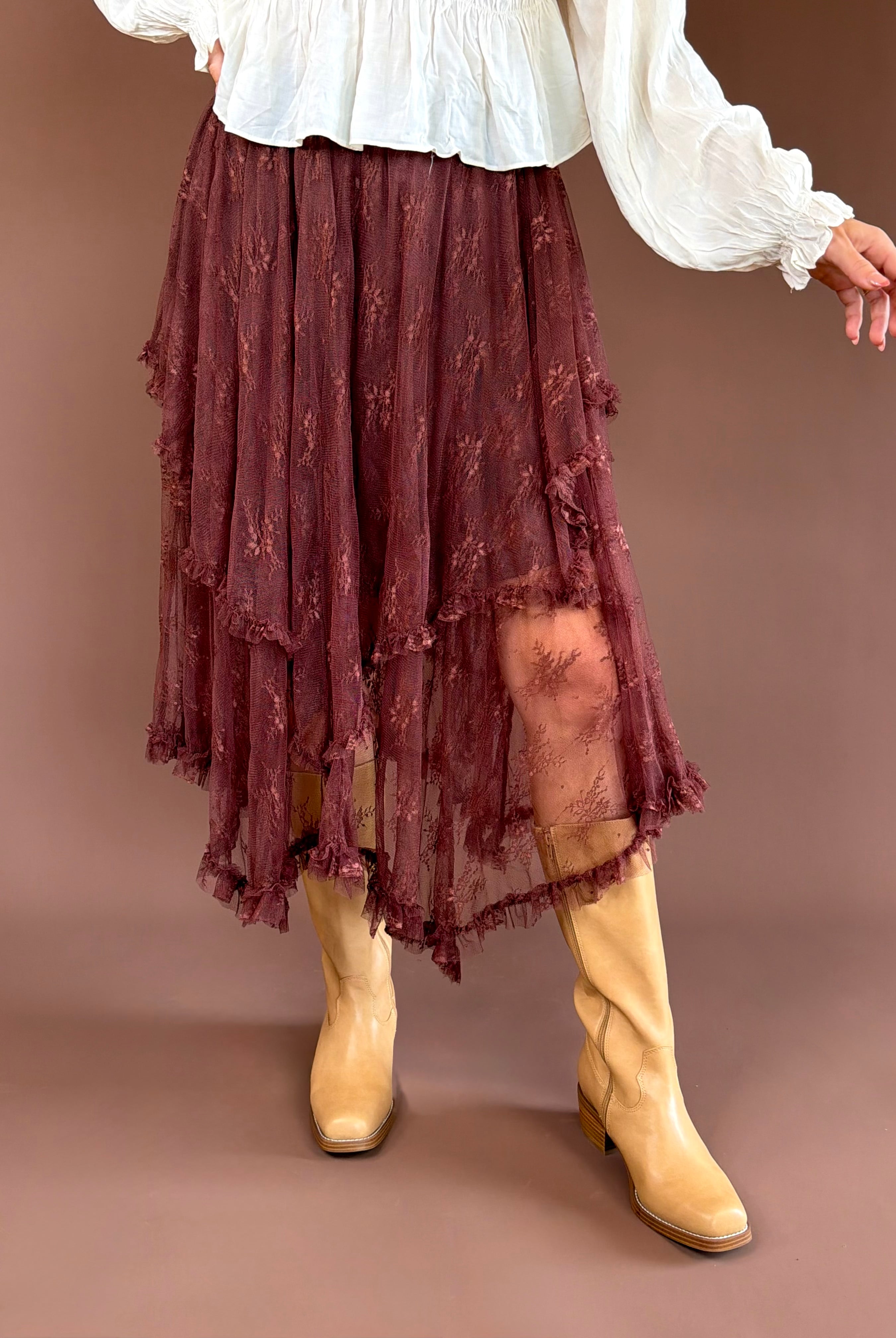 Brown Eyed Girl women’s chestnut brown midi skirt with tiered ruffles, lace hem detailing, and an adjustable elastic waist.