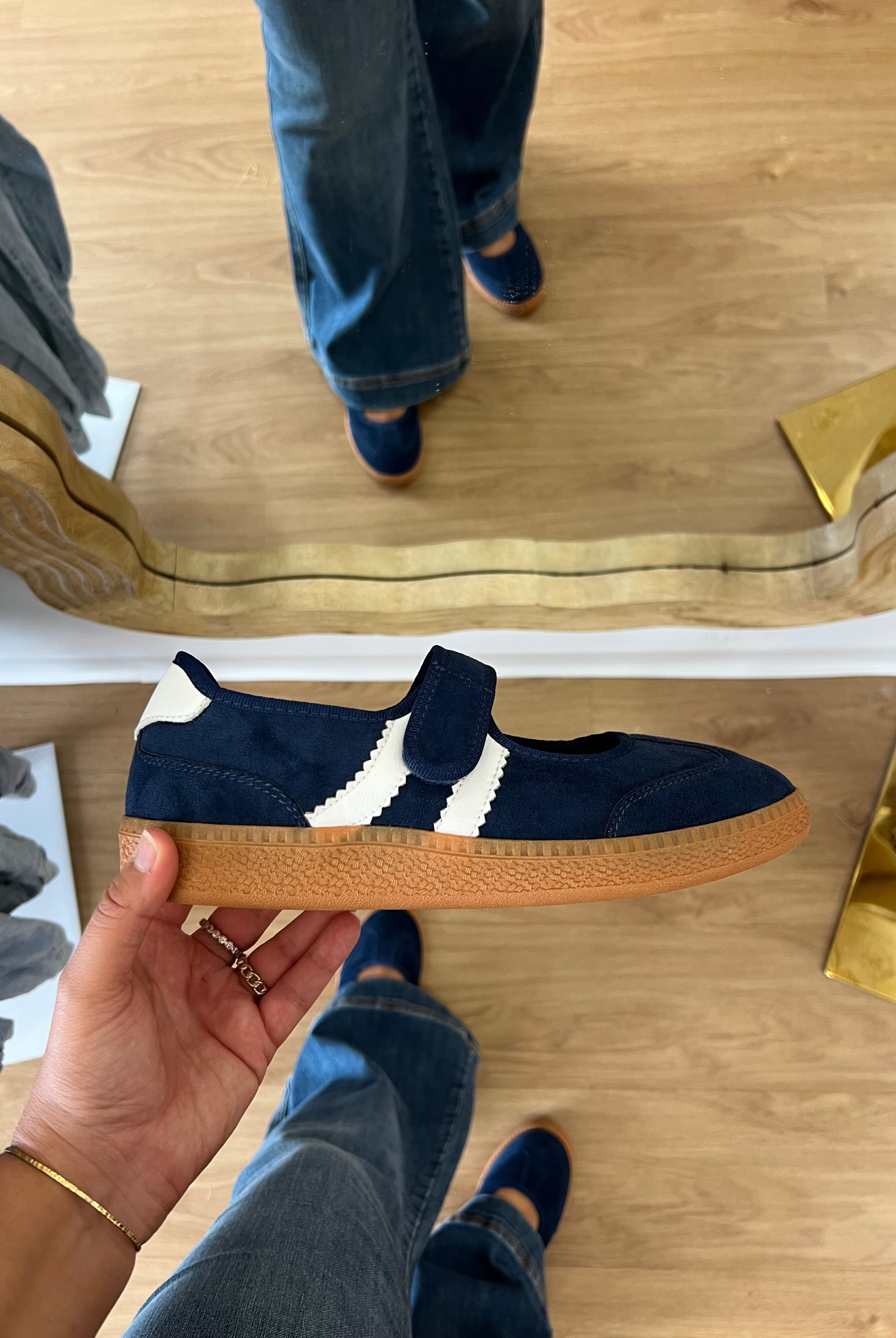 Corky’s Calm Down women’s navy Mary Jane sneakers with an adjustable top strap, cream side stripes, cushioned footbed, and gum soles