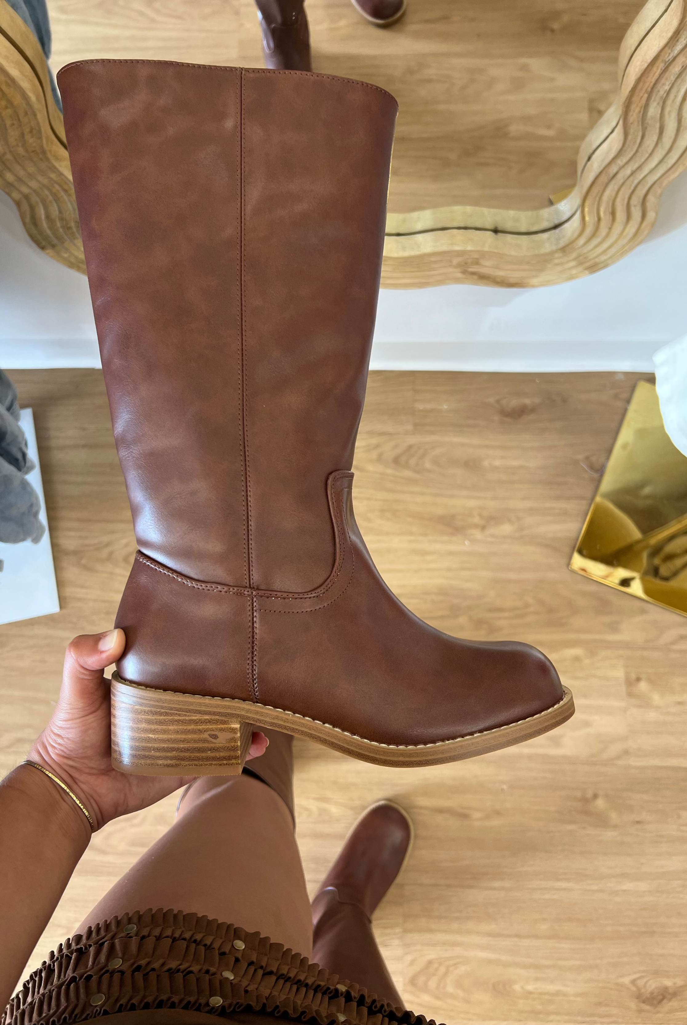 Corkys Put Up Or Shut Up women's cognac-brown knee-high riding boot with a rounded toe, stitched detailing, and low stacked heel.