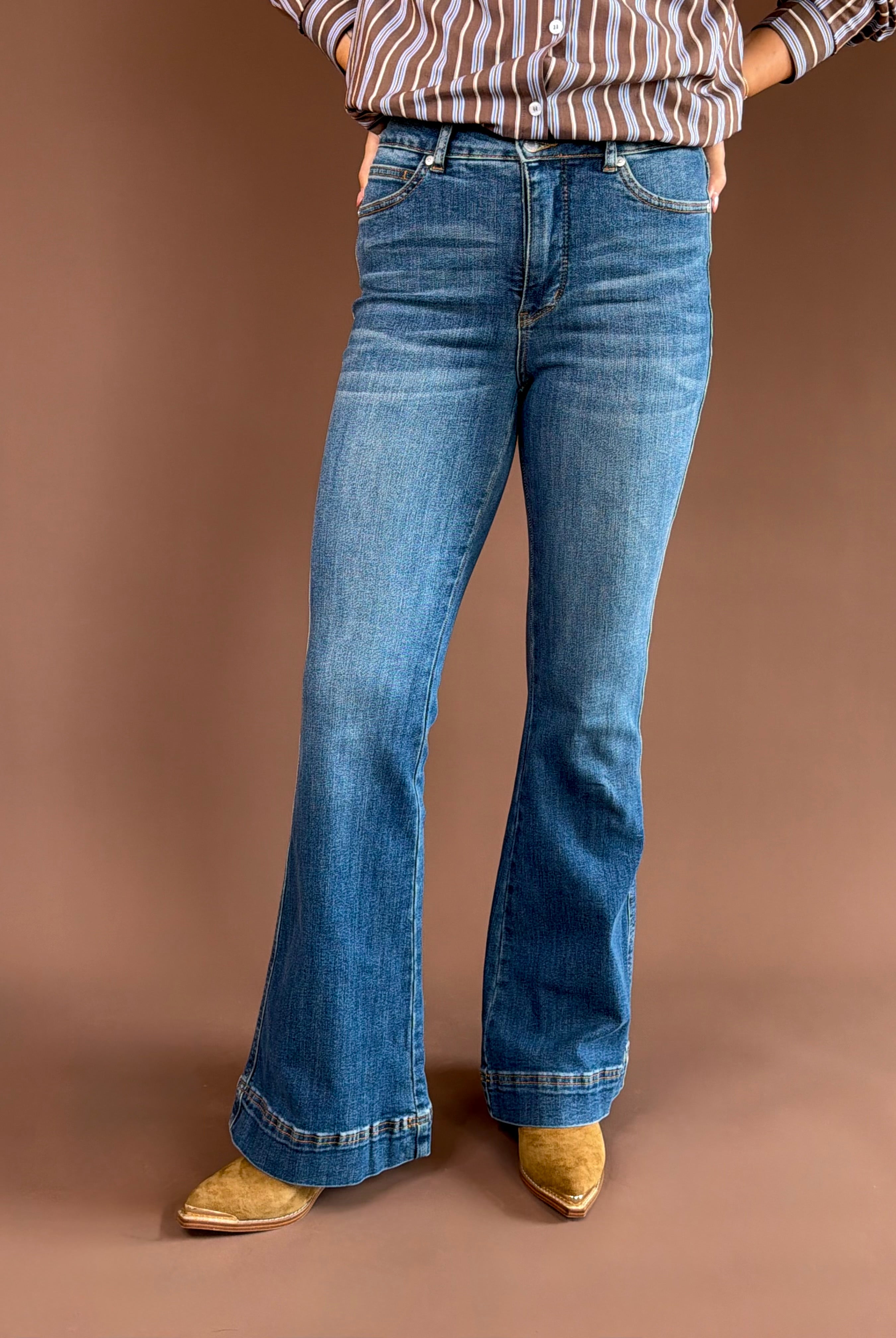 Judy Blue women’s high-rise tummy-control flare jeans in a vintage wash with a double-button waist and 33-inch inseam.