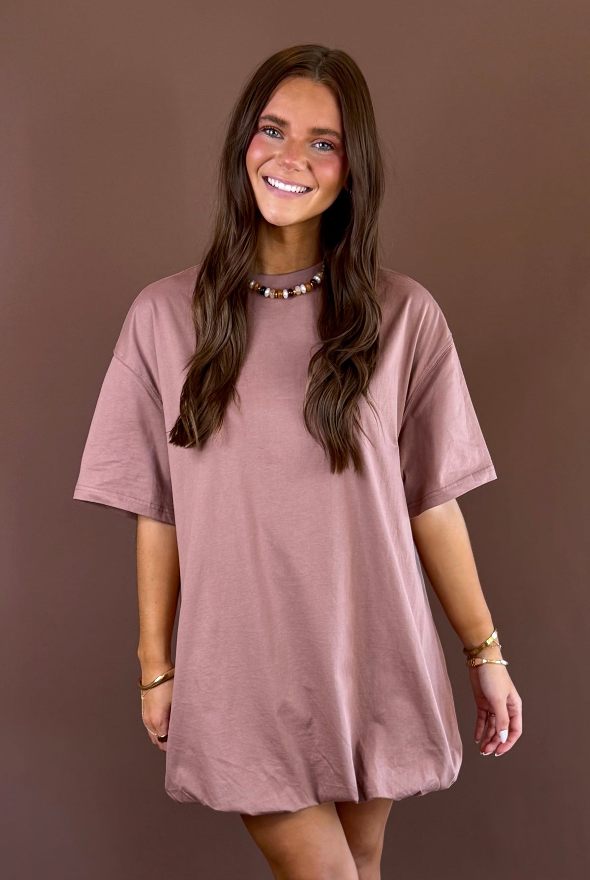 Off Duty women’s mocha cotton T-shirt dress with a round neckline, short sleeves, relaxed loose fit, and playful bubble hem silhouette