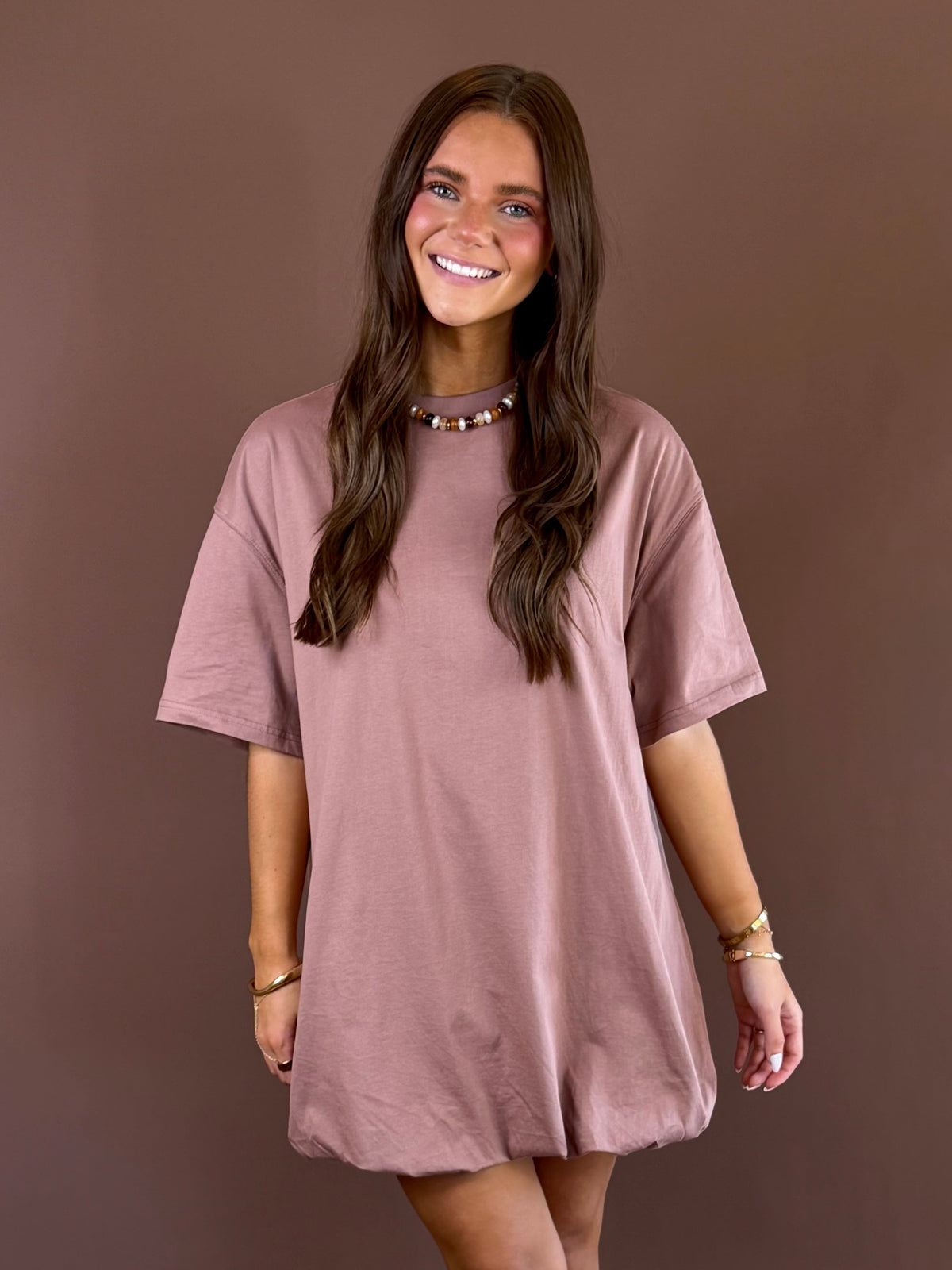 Off Duty women’s mocha cotton T-shirt dress with a round neckline, short sleeves, relaxed loose fit, and playful bubble hem silhouette