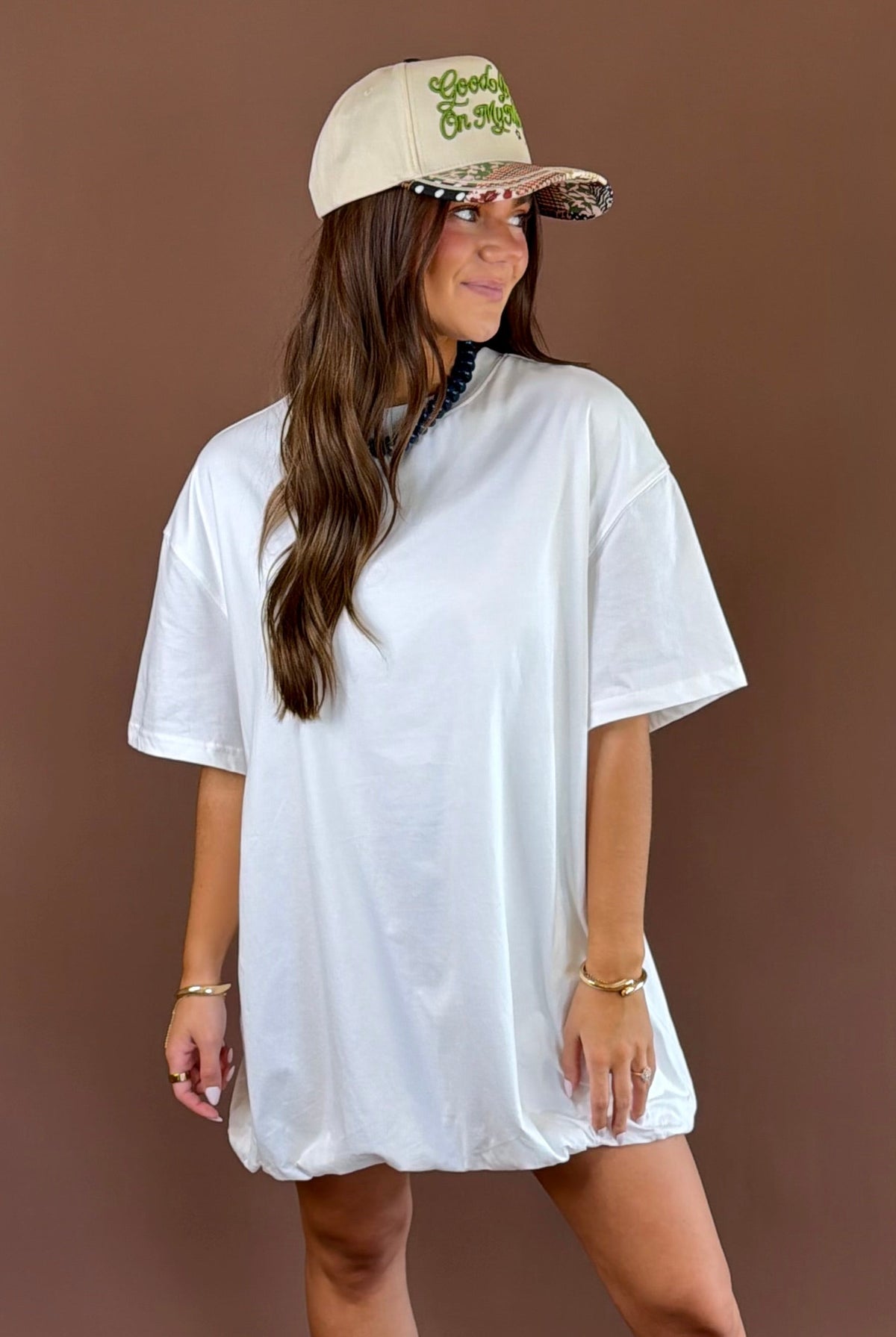 Off Duty women’s off-white cotton T-shirt dress with a round neckline, short sleeves, relaxed fit, and playful bubble hem silhouette