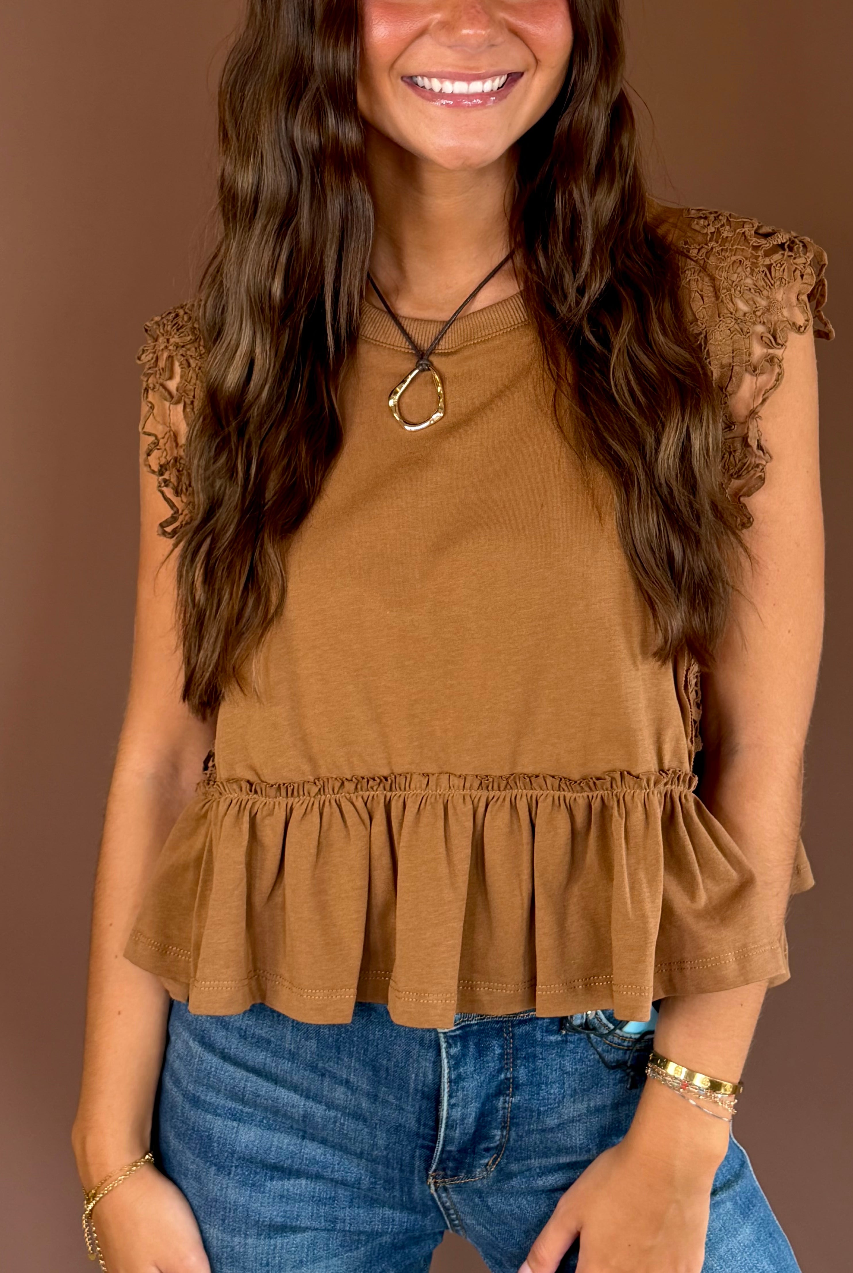 Simply Lovely women’s cinnamon cotton top with cap sleeves, a round neckline, side lace trim, and a feminine ruffled hem.