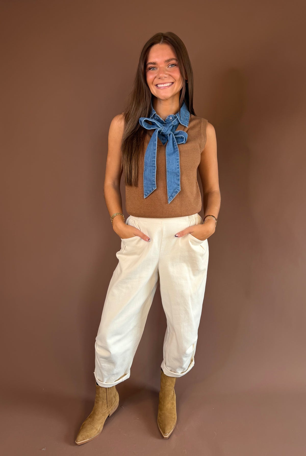 Sleeveless sweater-knit top with a removable denim tie neckline and mixed-texture Western-preppy design.