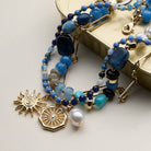 Multistrand beaded bracelet with gold charms on a light background, blue and gold necklace, accessory, summer necklace, gifts, necklaces 
