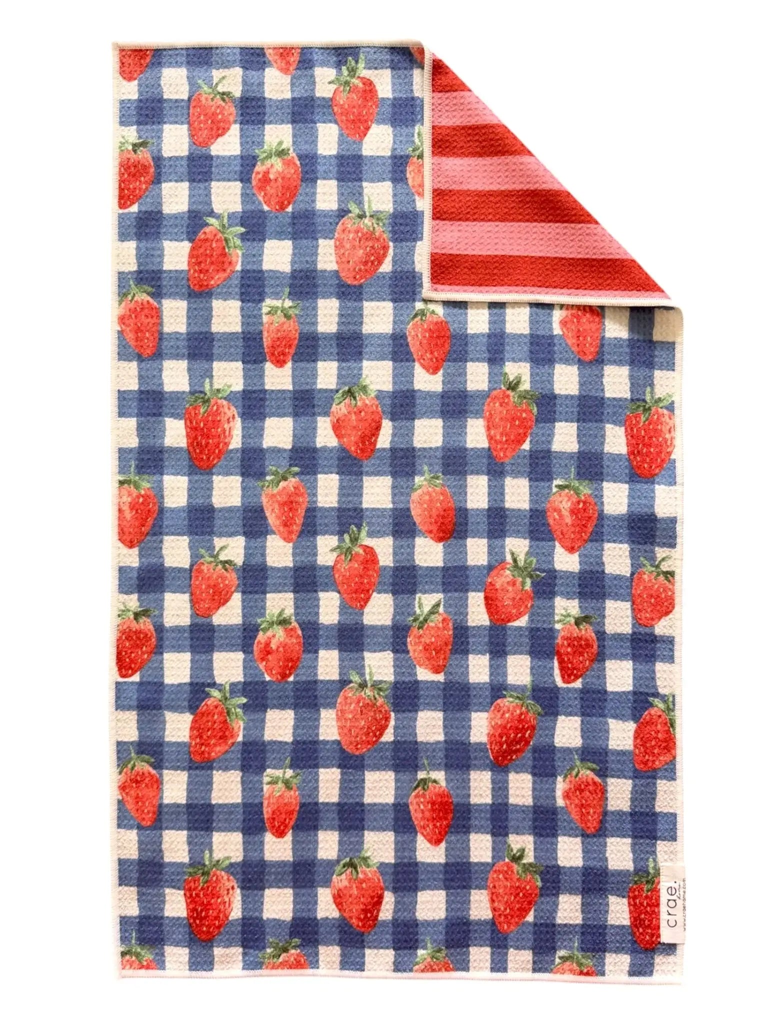 Towel with strawberry pattern on a blue and white checkered pattern, reversible side has red and pink stripe pattern, hand towel, kitchen towel, gift