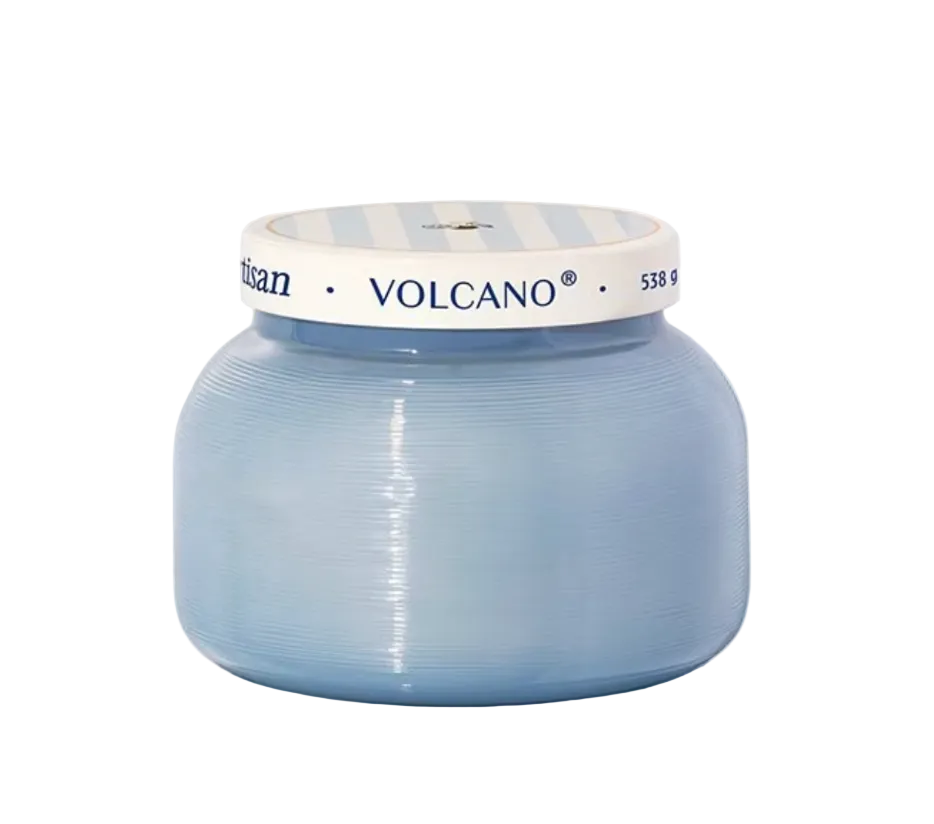 Blue candle jar with 'Volcano' branding on a white background