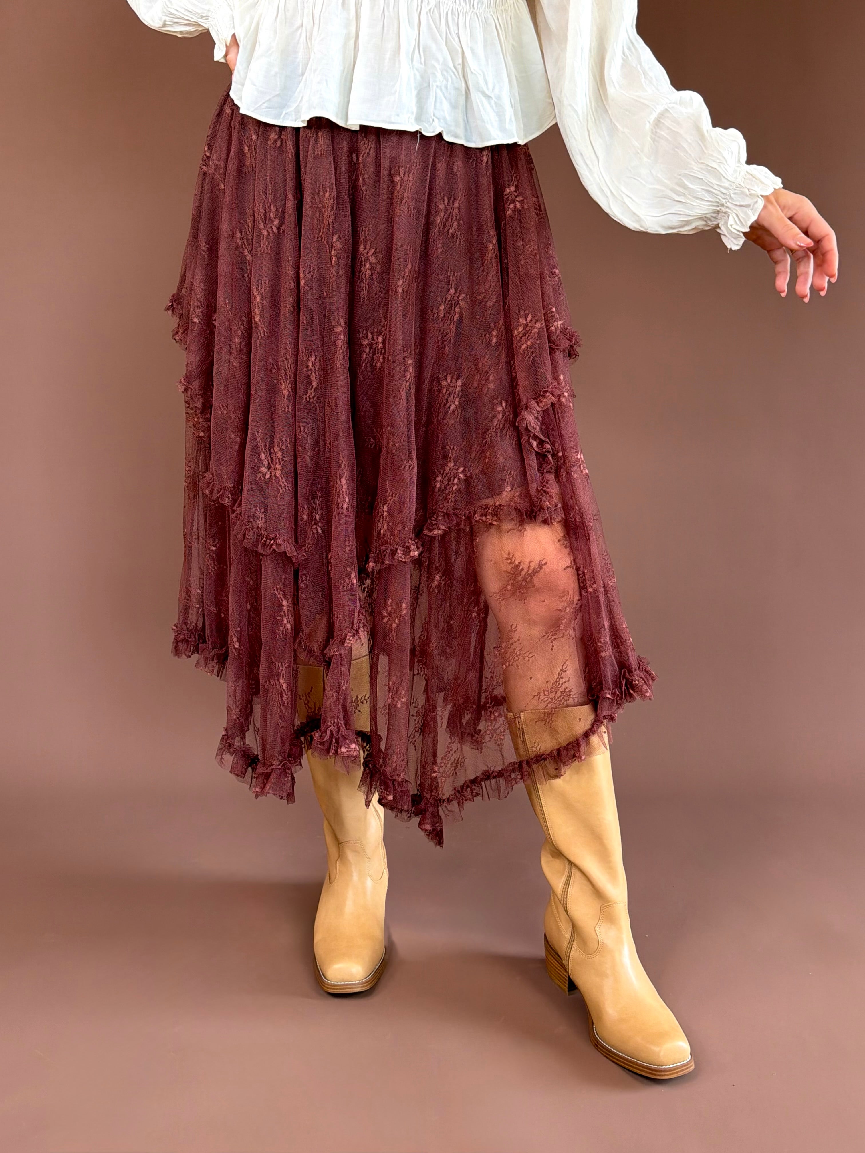 Brown Eyed Girl women’s chestnut brown midi skirt with tiered ruffles, lace hem detailing, and an adjustable elastic waist.
