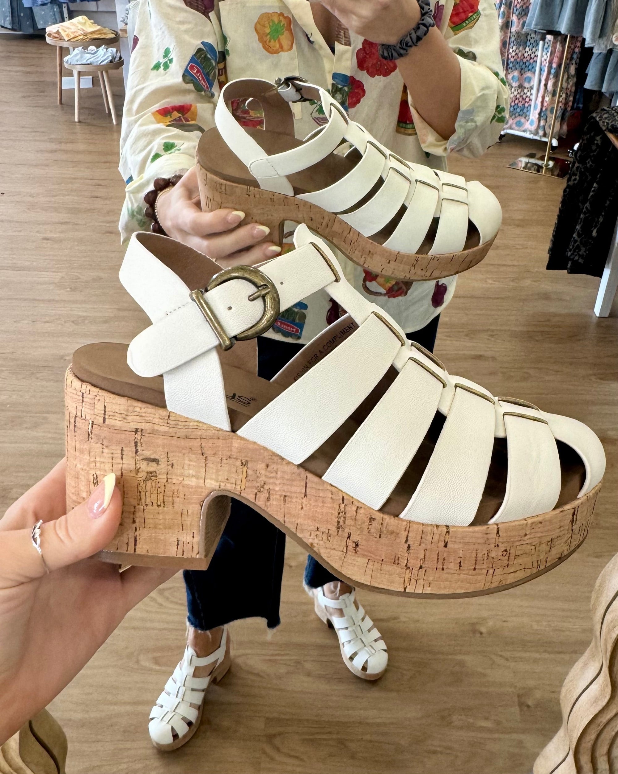 Corky's Fishin For A Compliment women's platform shoe with a strappy closed-toe upper, adjustable buckle ankle strap, and chunky cork heel.
