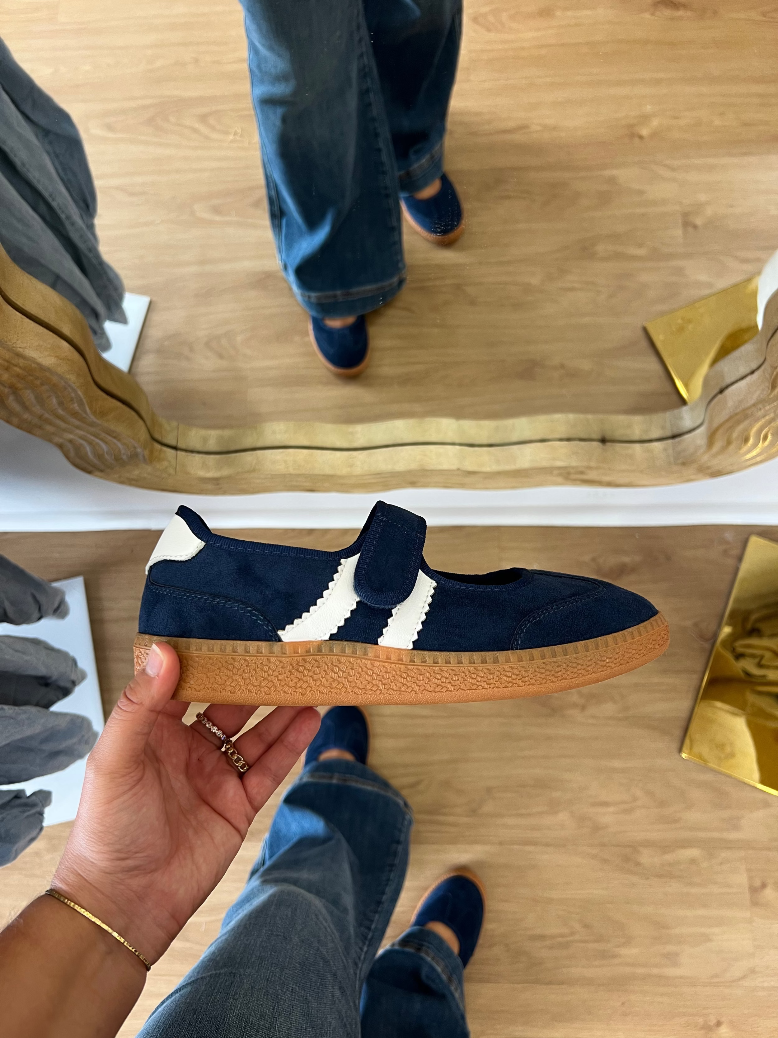 Corky’s Calm Down women’s navy Mary Jane sneakers with an adjustable top strap, cream side stripes, cushioned footbed, and gum soles