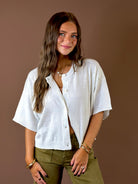 Easy Does It Short Sleeve Cardigan White Melange featuring white melange short sleeve cardigan with round neckline and rolled edges