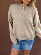Fable & Fern women's light mocha knit henley sweater with long sleeves and a rolled hem.