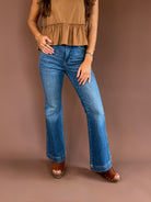 Judy Blue women’s petite high-rise tummy-control flare jeans with a double-button waist, vintage wash, and 30-inch inseam.