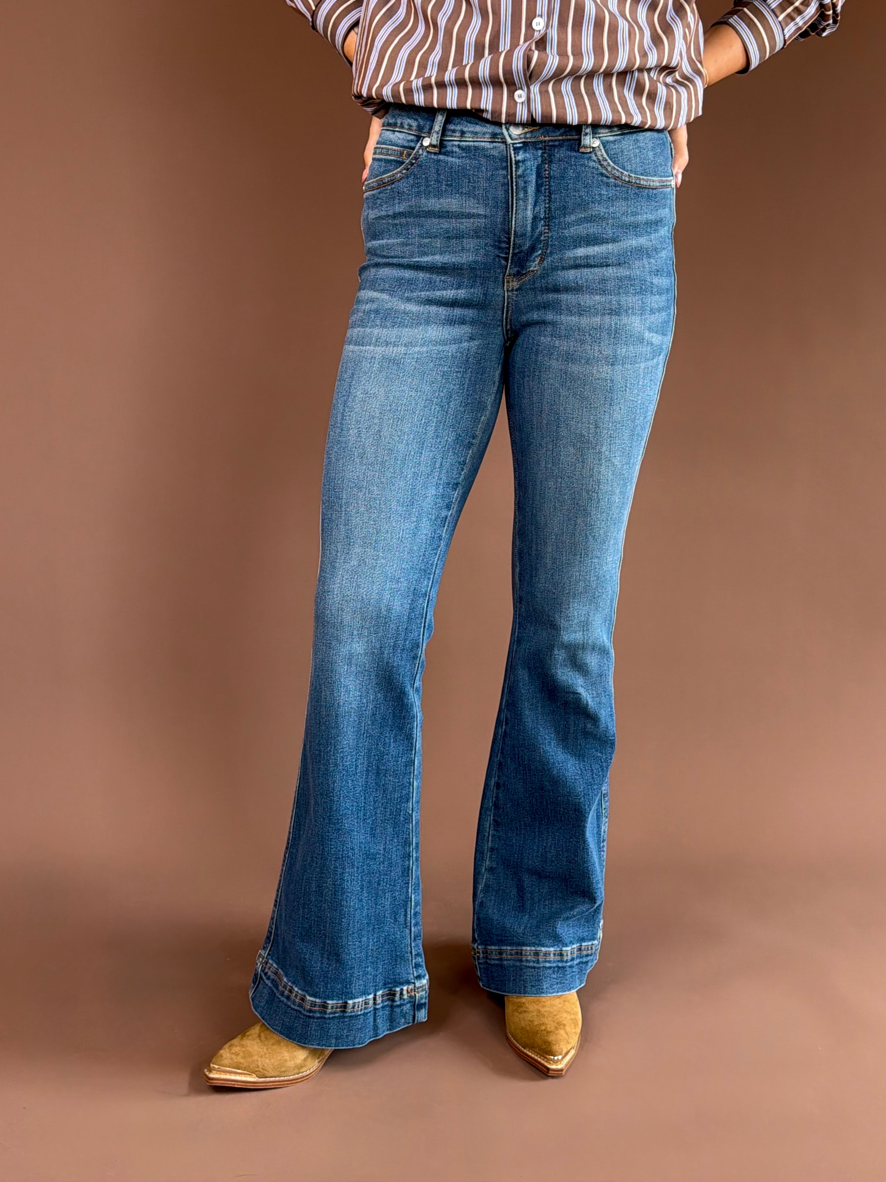 Judy Blue women’s high-rise tummy-control flare jeans in a vintage wash with a double-button waist and 33-inch inseam.