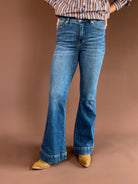 Judy Blue women’s high-rise tummy-control flare jeans in a vintage wash with a double-button waist and 33-inch inseam.