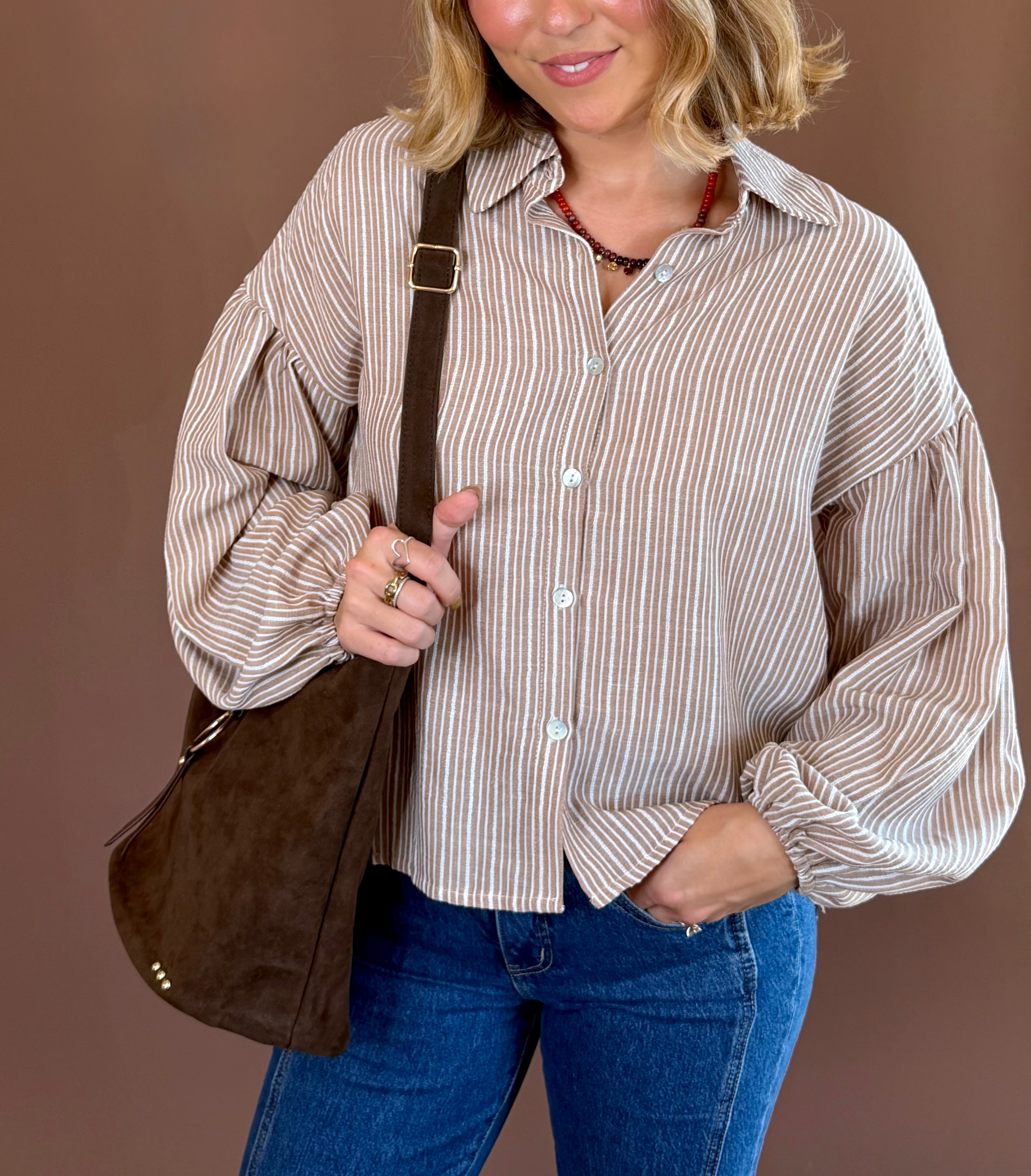 Latte Lines women's tan-and-cream striped blouse with a collared neckline, button-front closure, and voluminous long lantern sleeves.