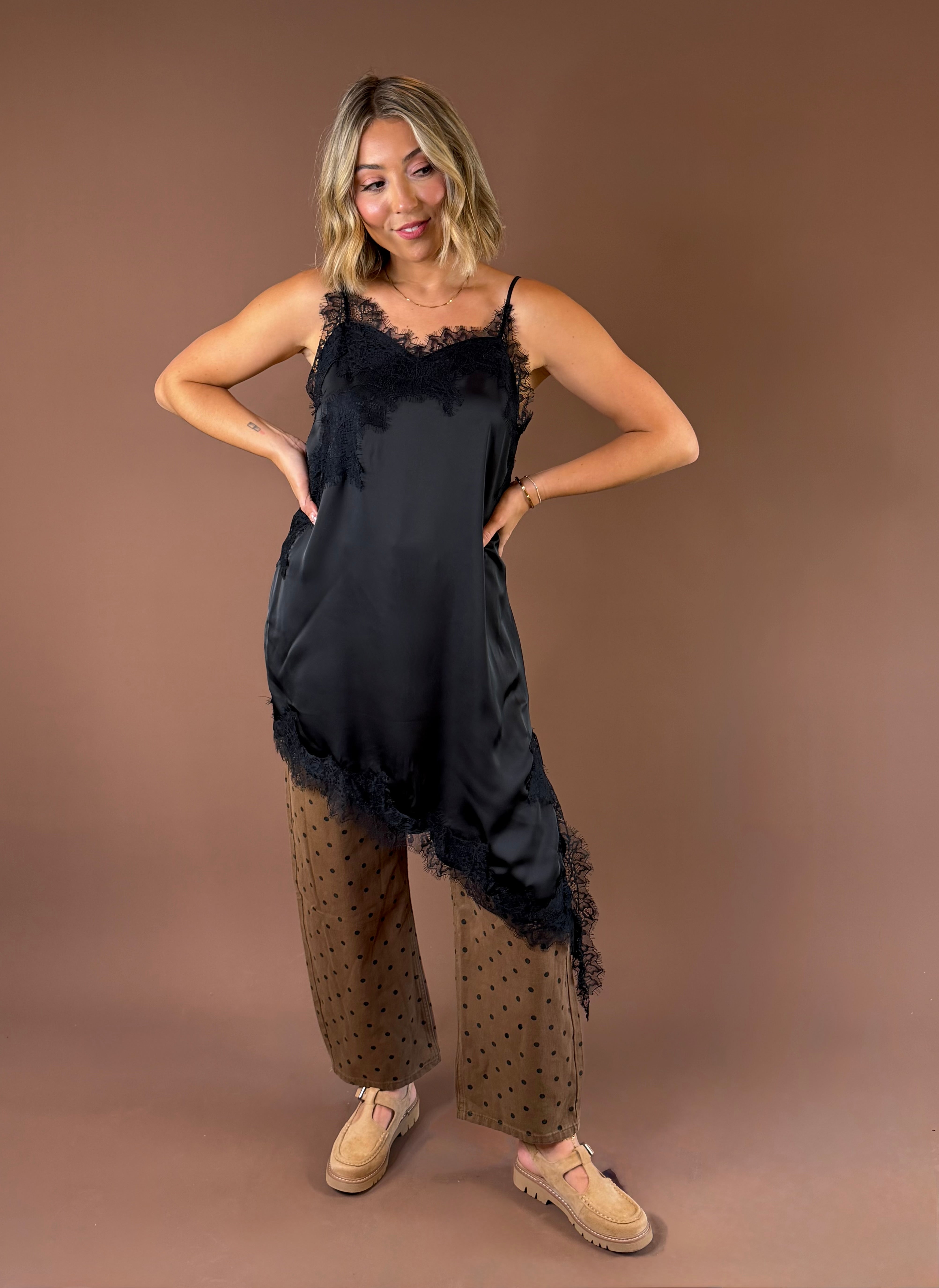 Love Story women’s black satin slip mini tunic dress with delicate lace detailing, adjustable spaghetti straps, and an asymmetrical hem