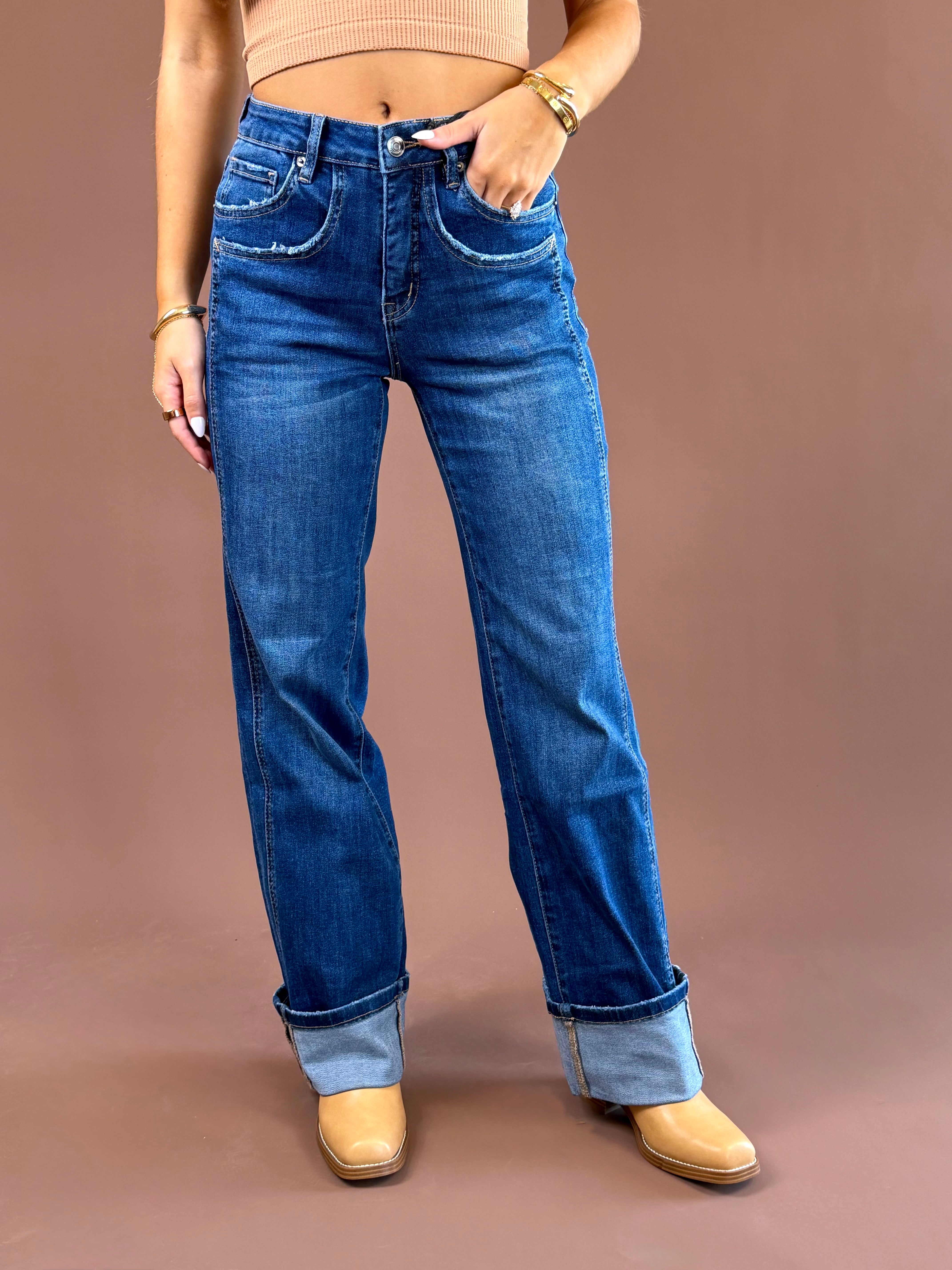 MICA Easy Does It women’s medium-wash high-rise jeans with a relaxed wide-leg silhouette, five-pocket styling, and wide cuffed hems