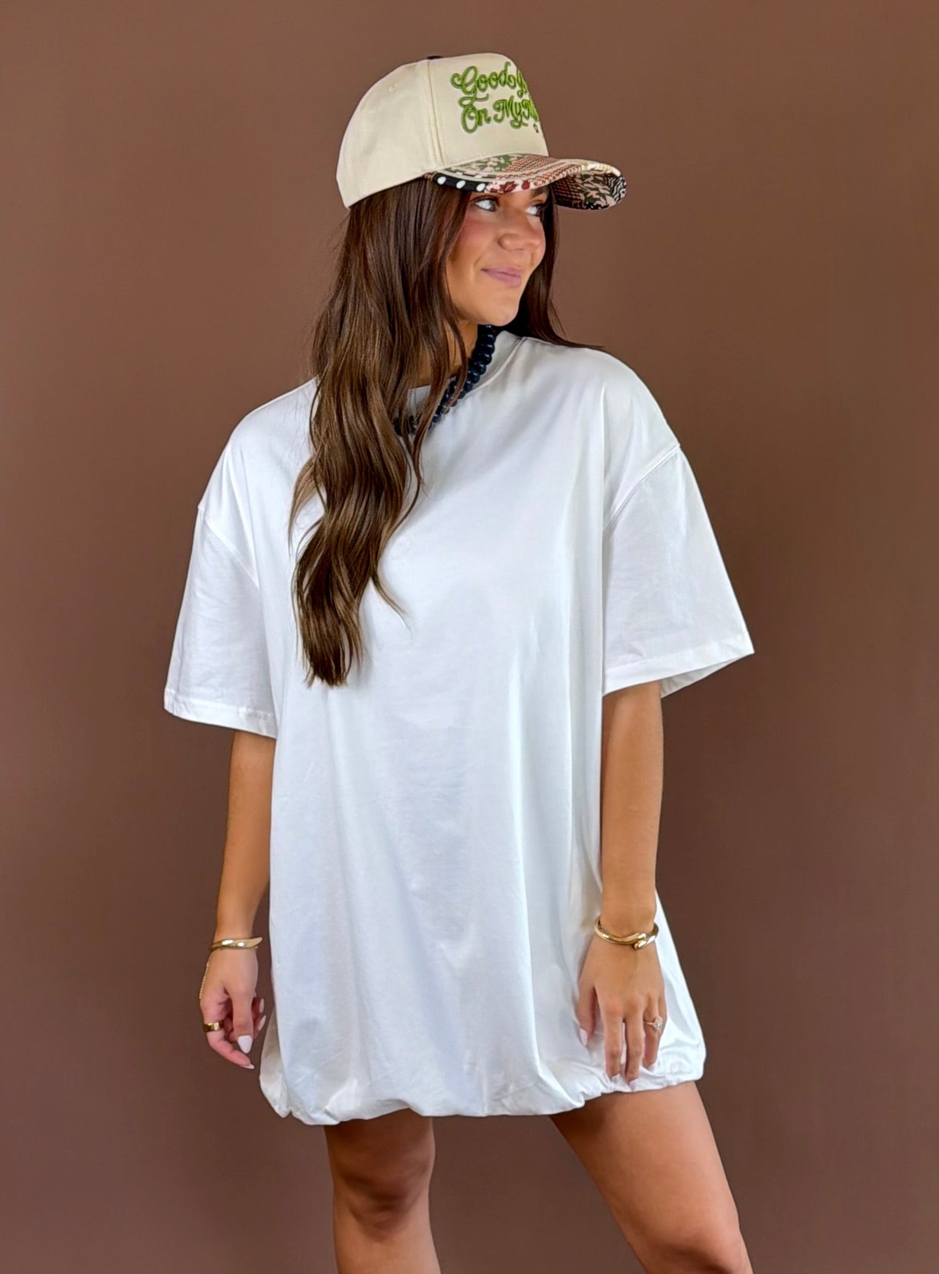 Off Duty women’s off-white cotton T-shirt dress with a round neckline, short sleeves, relaxed fit, and playful bubble hem silhouette