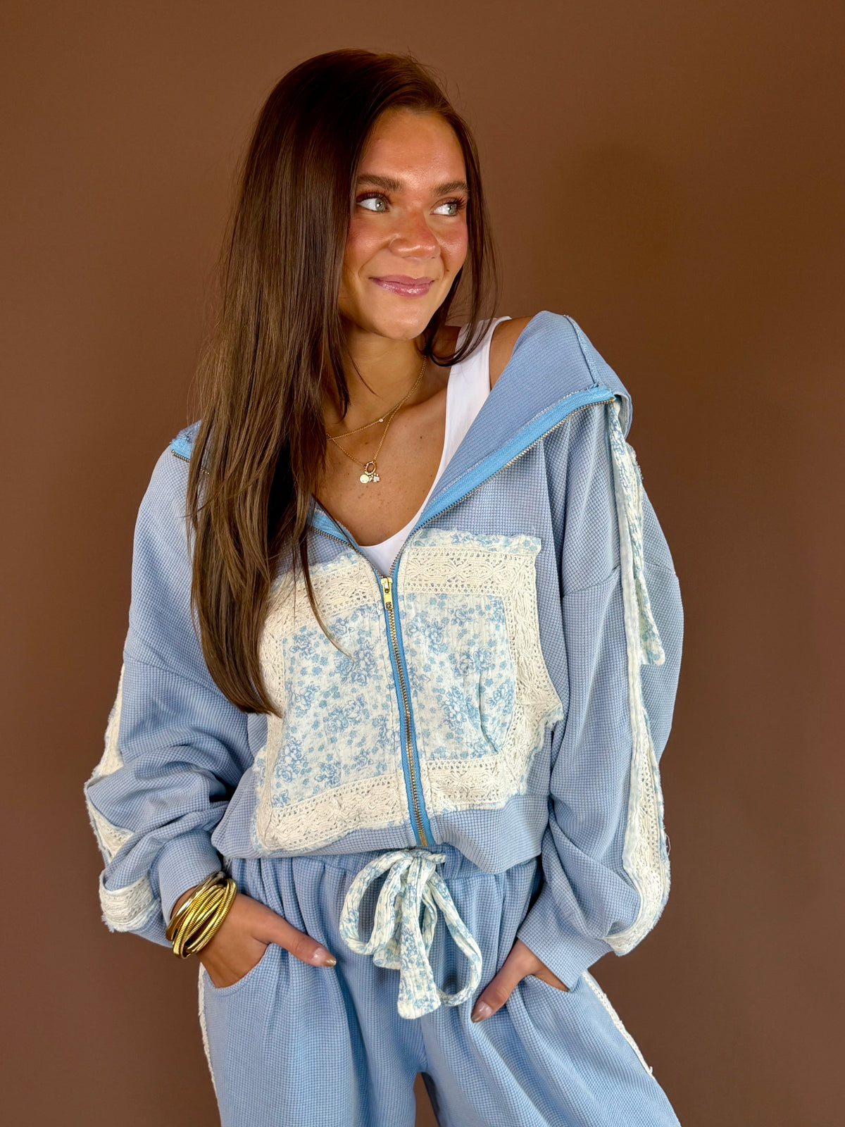 Vintage-wash hooded jacket with thermal and double-gauze textures, crochet trim, zip front, and pocket.
