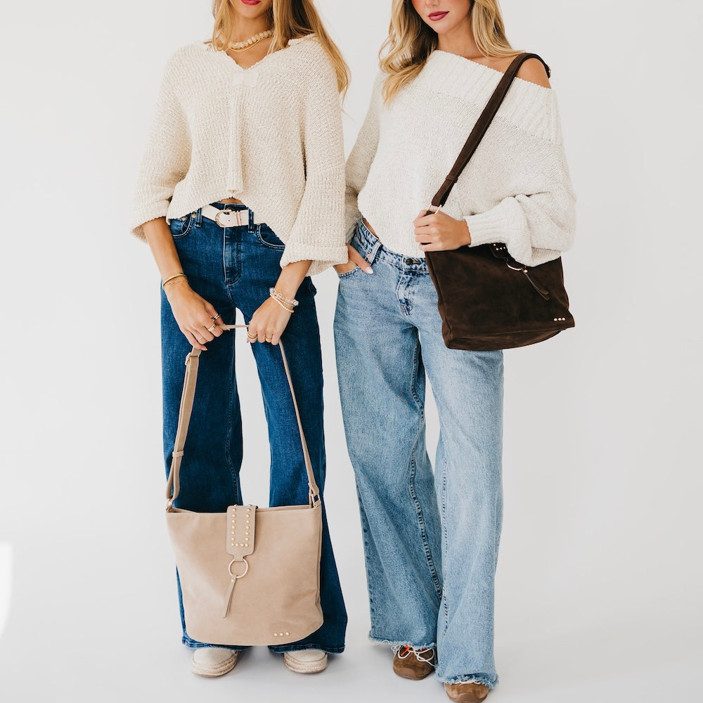 Rosemary faux-suede bucket bags with rounded, structured silhouettes, shown in the product's neutral color selection.