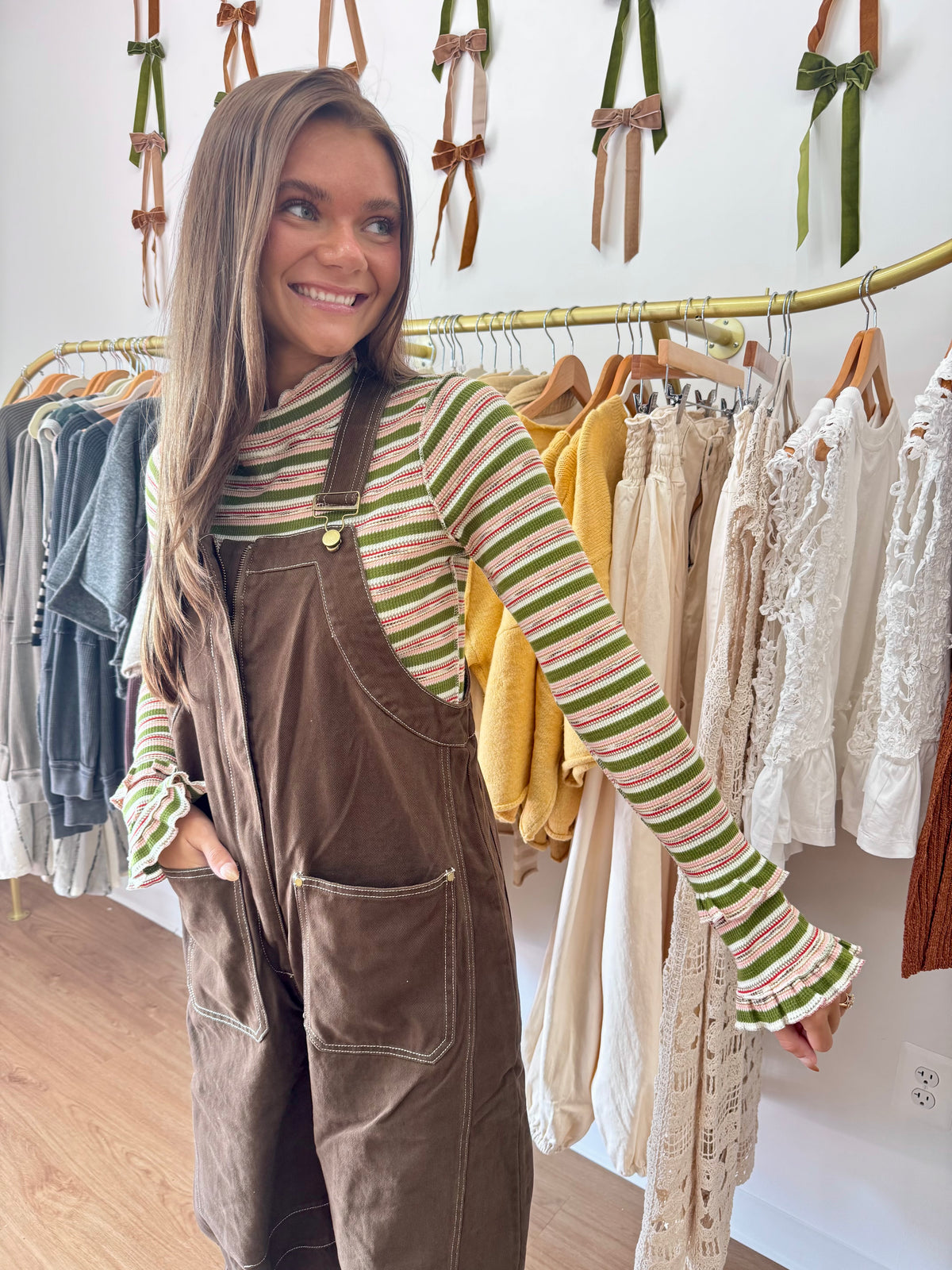 Rosie Strawberry Matcha women’s striped long-sleeve top with a mock neckline, full-length fit, and feminine ruffle hem.