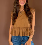 Simply Lovely women’s cinnamon cotton top with cap sleeves, a round neckline, side lace trim, and a feminine ruffled hem.