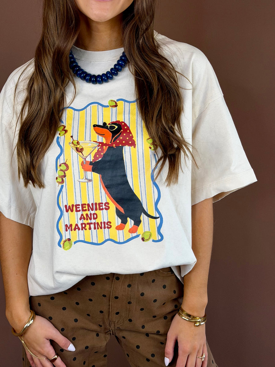 Weenies and Martinis women’s bone-white washed graphic T-shirt with a round neckline, short sleeves, and relaxed oversized fit